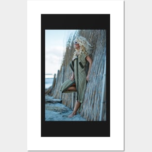 Sexy woman in cardigan on the sea shore Posters and Art